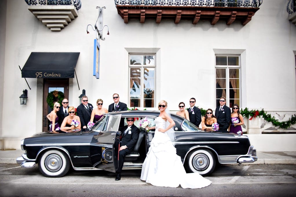 Wedding party with vintage car